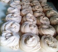 Round spiralled ball of knead dough.